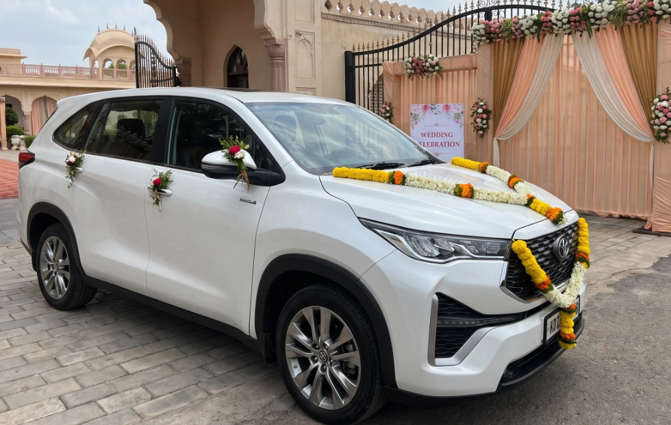 Elegant Innova Hycross wedding car rental in Coimbatore for weddings and special events.